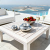 Large VVC silver hammered aluminium outdoor ashtray styled on a poolside table with strawberries and champagne in Sitia, Crete.