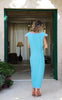 Back view of turquoise and neon pink VVC™ maxi dress showing V-shaped back illusion and elegant fit for tall, curvy women