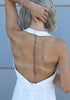back view of white halter jumpsuit showing open back and concealed zipper, designed for taller silhouettes by VVC.