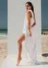 Side view of the VVC white cotton maxi dress showing the elegant high slit
