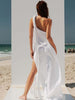 Back view of the VVC white one-shoulder cotton maxi dress with macramé shoulder detail