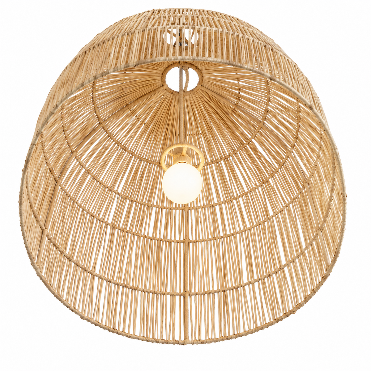 A dome-shaped woven rattan pendant light shade with a warm natural wood tone, featuring a glowing light bulb at the center against a plain white background - on sale at the vvc shop sitia.