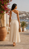 White asymmetric one-shoulder ruched summer top shown from the back with a linen maxi skirt in Crete, available at VVC Shop Sitia and online.