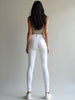 Back view showing pocket design and sleek fit of White Miss Sister stretch jeans