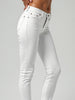 Side view of Miss Sister skinny jeans in white light wash denim in Sitia