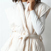 White hooded vest with wide armholes and tie belt from VVC Shop Sitia