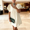 close up of Luxury Italian mini dress styled with sandals in Crete