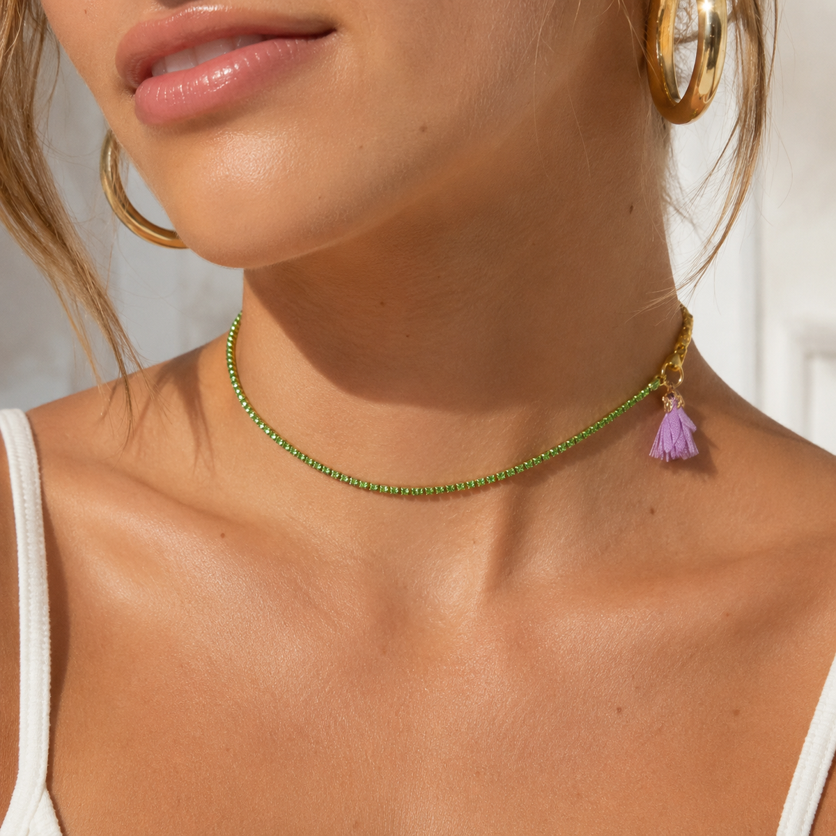 Green 40 cm strass necklace with purple textile flower and gold closure, worn boho style, available at VVC SHOP Sitia Crete and viktoria-vigh.com