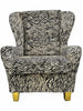 Full front view of zebra cowhide leather armchair with ear-shaped backrest on white background