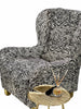 Side view of Moroccan zebra cowhide armchair showing shape, leather texture and seat depth on white background