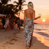 Back view of zebra print maxi beach cover-up with adjustable straps and flowing fit, perfect for summer beach fashion.