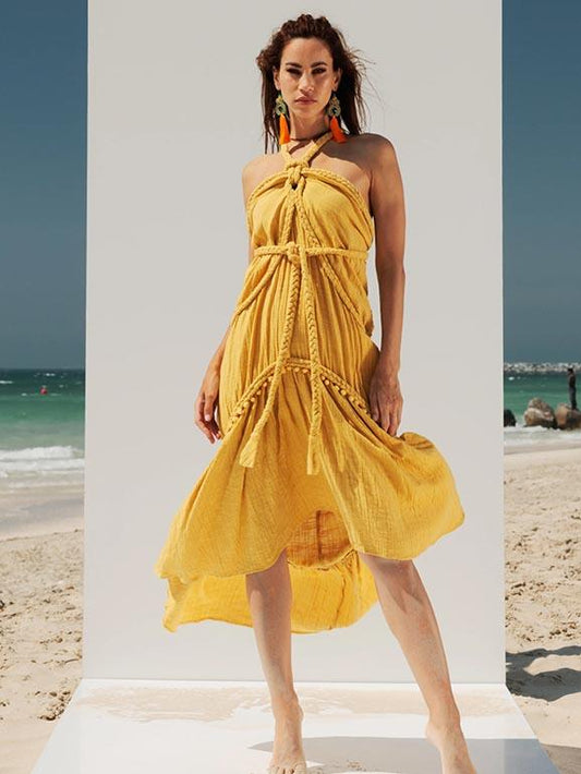 Full-length view of the Zoe Artemis mustard-yellow cotton-crepe summer maxi dress with an A-line silhouette and asymmetric high-low hem.