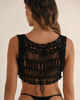 Close-up back view of the Zoe black macramé cropped vest, showing intricate handmade cotton knotwork, wide straps and an open boho design in size XS/S.