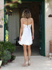 Back view of the ZOE white Feather short wedding dress showing its decorative chain straps and concealed back zip, made in Greece.